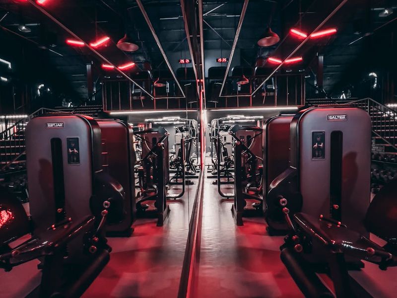 Minimalist training space with red neon light accents